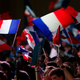 Supporters wave French national flags during a campaign rally at the Porte de Versailles in Paris on April 9, 2017. (Geoffroy Van der Hasselt/AFP/Getty Images)